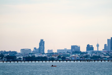 Fototapeta premium sunset orange cloud fishing boat on sea city