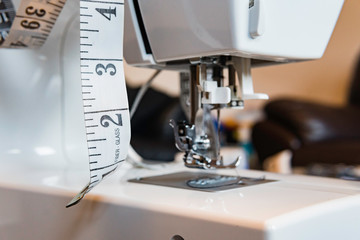 Sewing machine needle with measuring tape