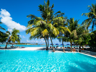 Fototapeta na wymiar Maldives island with pool and water bungalows, South Male Atoll, Maldives