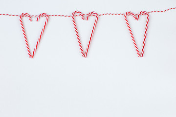 heart-shaped candy sticks hung on ropes