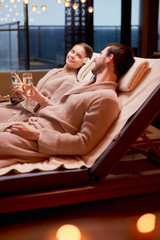 Beautiful caucasian couple in love relax spending time in spa center together, enjoy spa...