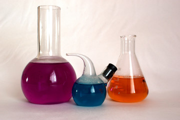 multicolored chemicals in flasks in the lab