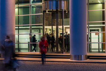 The movement of people at the entrance to modern building