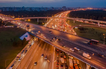 View from the air on the movement of cars on the overpasses at the intersection with the ring road...