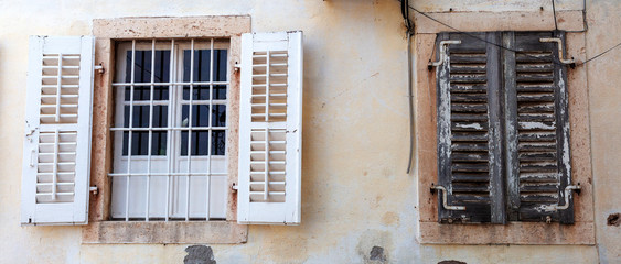 Fototapeta na wymiar old Windows in stone wall, background, Perast, Montenegro