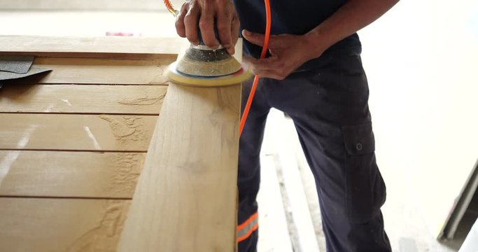 Woodworking. Sanding on wooden in 4K resolution