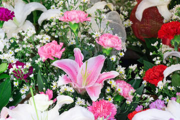 Fototapeta premium Carnation flowers and Chrysanthemum flowers in bouquet at flower market,pattern background,selective focus