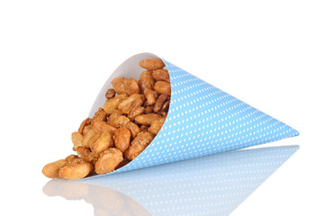 spilled honey covered peanuts in blue paper cone