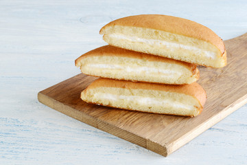 stack of sponge cake slices with vanilla cream filling