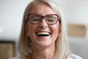 Close up portrait middle-aged attractive laughing woman