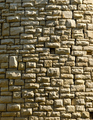 ancient wall of the treated stone of various sizes