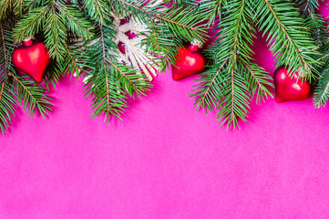 Christmas and New Year theme decorated background, top view, with Christmas tree branches and ornaments