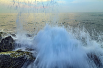 storm waves are breaking about the breakwater