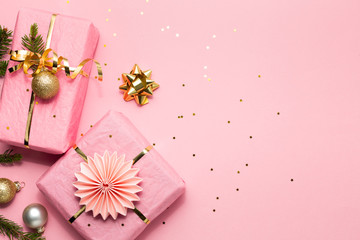 Beautiful Chritmas background with gifts and ornaments in pink and gold