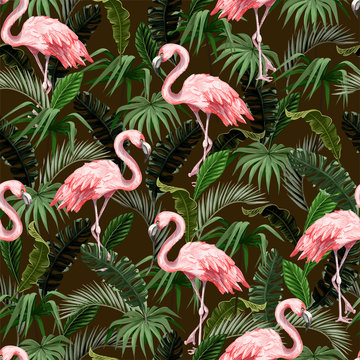 Seamless pattern with flamingo and tropical leaves. Vector. © Yumeee