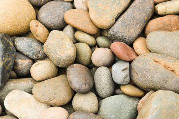 Fototapeta na wymiar pebbles stone beach on the floor, pebbles stone background texture.