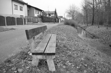 wooden bench in the city park plzen