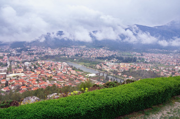 Obraz premium Foggy spring day. View of Trebinje city from Crkvina Hill. Bosnia and Herzegovina, Republika Srpska