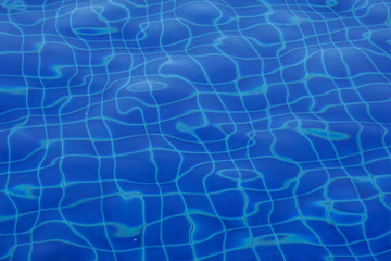 Obraz premium Blue swimming pool water ripple background.