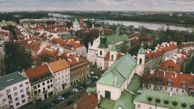 Aerial shot of Warsaw Old Town buildings and the Vistula river, Poland