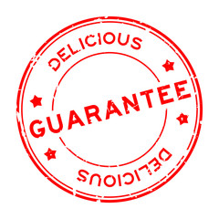 Grunge red guarantee delicious word round rubber seal stamp on white background