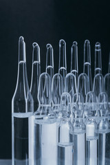 Glass medical ampoule vial for injection. Medicine is dry white drug penicillin powder or liquid...