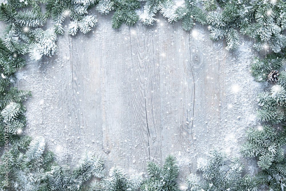 Poster christmas and new year background with fir branches and snowfall