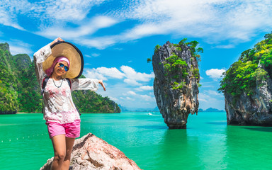 Summer lifestyle traveler woman joy fun amazing scenic landscape James Bond island famous landmark...