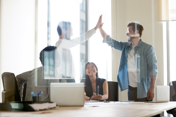 Colleagues giving high five greeting each other or express respect