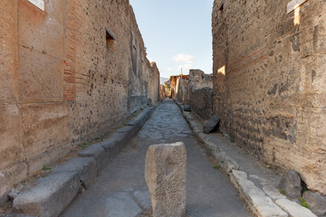 Street in Pompeii (Pompei) and Vesuvius mountain.