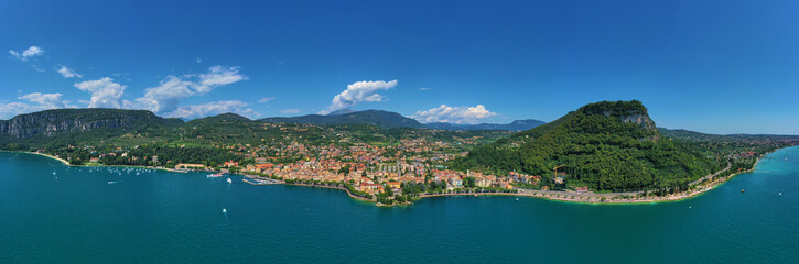 Naklejka na ściany i meble Panoramic view of the resort town of Garda the north of Italy. Aerial photography. Rocca Del Garda.