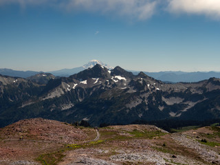 Fototapeta na wymiar Mount Rainier and the Cascade Range with Reflection Lake and a Marmot