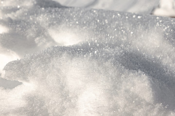 Background of freshly fallen fresh snow, candid winter image. Ideal for Christmas jobs, nativity scenes, gift cards, illustrations, children's drawings.