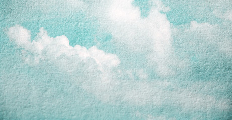 Double exposure of cloud and sky of paper texture for background Abstract,postcard nature art pastel style,soft and blur focus.