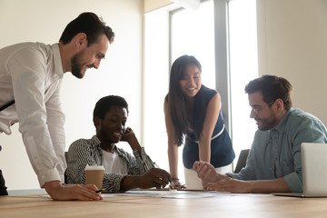 Diverse colleagues make summarizing of financial information together in boardroom