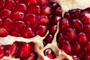 ripe juicy red pomegranate macro