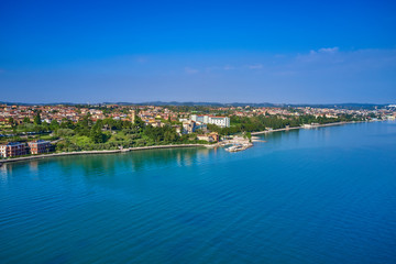 Fototapeta na wymiar Aerial photography with drone. Beautiful view of the city of Rivoltella del Garda, Italy.