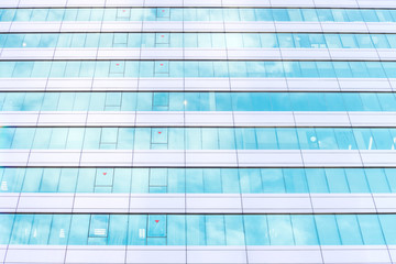 underside panoramic and perspective view to steel blue glass high rise building skyscrapers, business concept of successful industrial architecture