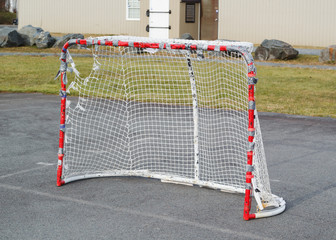 Hockey net on playground pavement