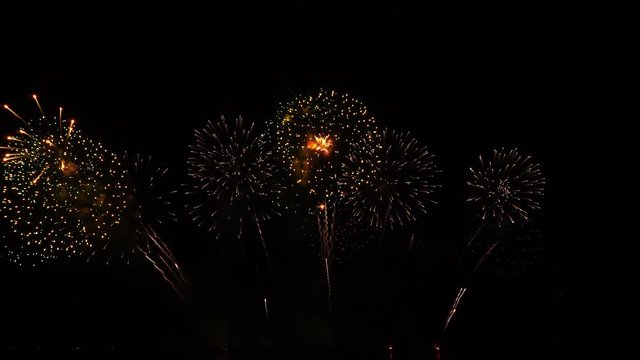 Real fireworks on black sky background - Fireworks festival show.