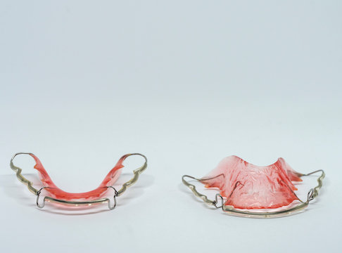 pink hawley retainers on isolate white background