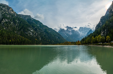 Fototapeta na wymiar Early autumn view of dolomites mountain and durrensee lake near South Tyrol, Italy.