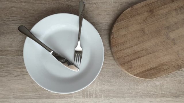 Place fork and knife over plate