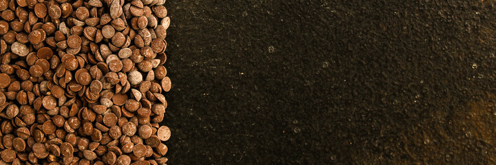 chocolate drops (black or milk chocolate, sweet ingredient) menu concept. food background. copy space. Top view