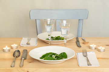 Romantic table setting in scandinavian style decorated with candles.