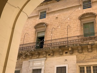 Fototapeta na wymiar Maltese streets with traditional houses in Valletta