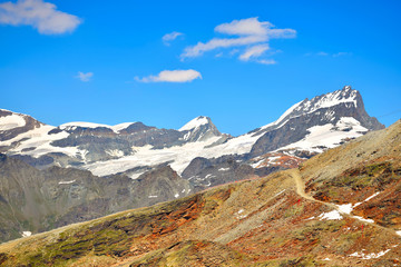 Fototapeta premium Epic view of Rimpfischhorn, Allalinpass and Allalinhorn from the Gornergrat Ridgeline, Zermatt, Switzerland