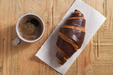 Croissant with chocolate and coffee