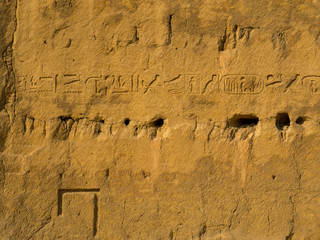 Hieroglyphics on the bedrock from which it  was carved the area where it was built the Pyramid of...