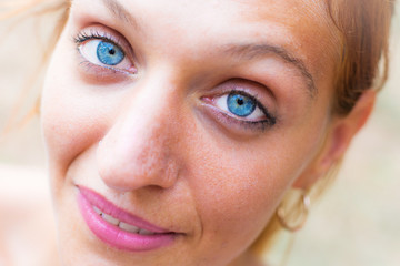 portrait of a beautiful young woman with blue eyes